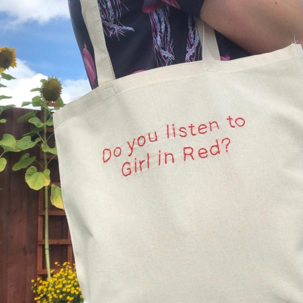 An embroidered tote bag for fans of girl in red.