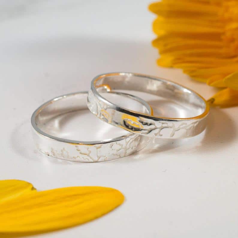 Wedding bands that feature an oak print. (Etsy/FragmentDesignsEtsy)