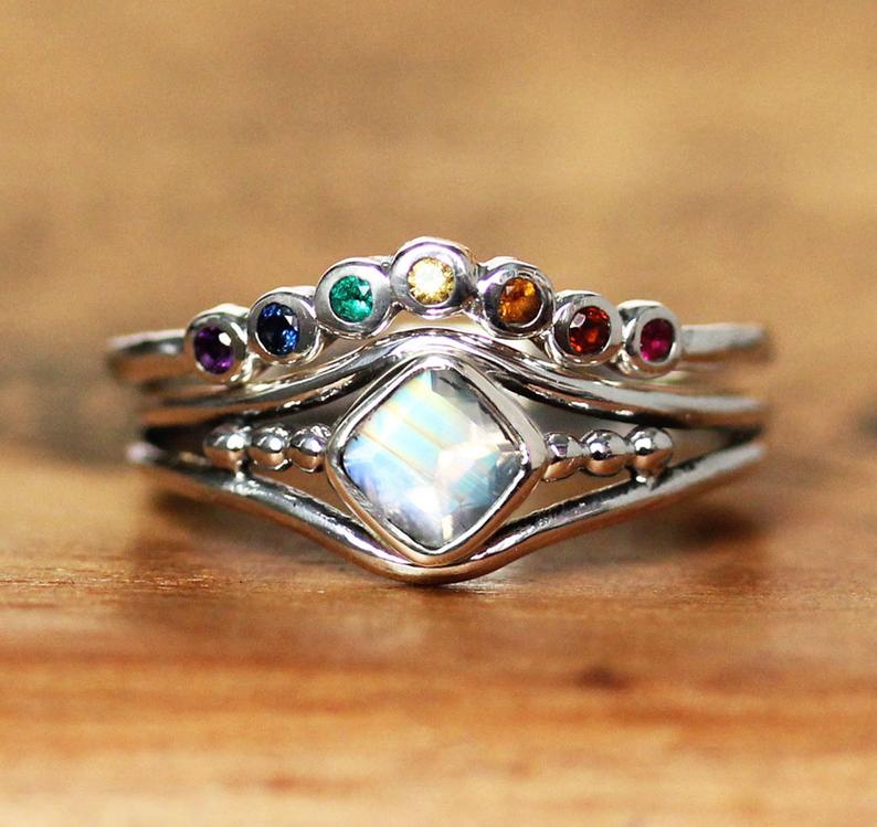 A stacked rainbow wedding ring that looks similar to a crown or tiara. (Etsy/metalicious)