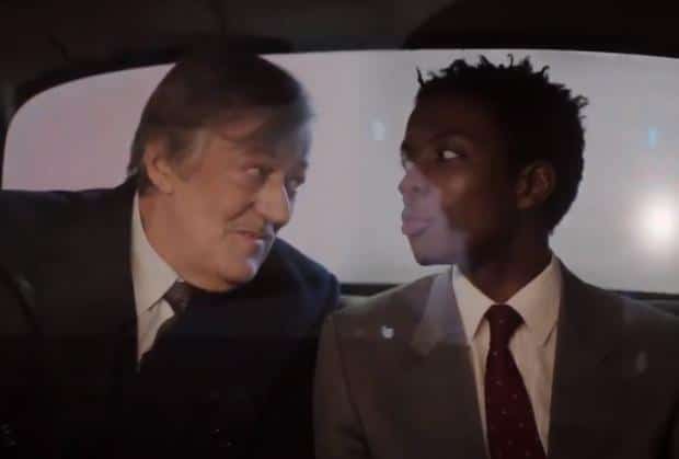 Stephen Fry and Omari Douglas (Arthur and Roscoe) in the back of a cab