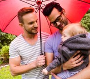 Gay dads with their child