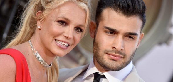 Close crop of Britney Spears and her boyfriend Sam Asghari smiling on the red carpet