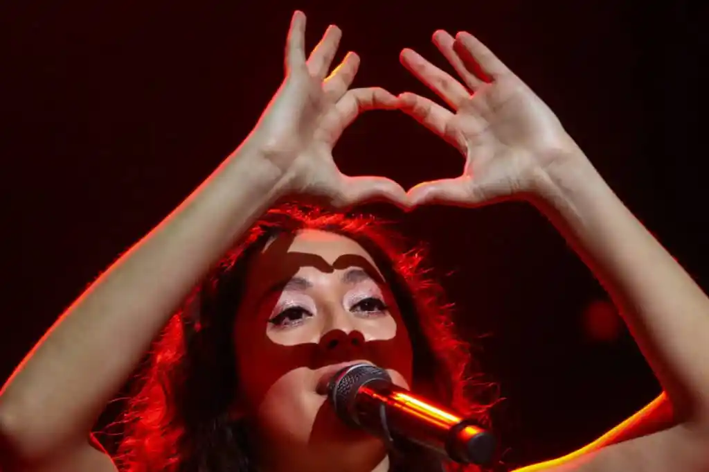Manizha Sangin makes a heart-shape with her hands
