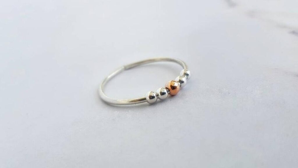 This ring comes with beads to help with anxiety and stress. (INNOCENTIJEWELRY)