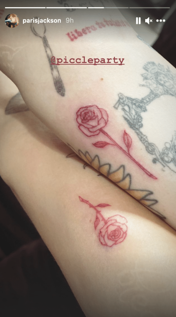 Paris Jackson and Cara Delevingne have their arms side-by-side to show off their rose tattoos