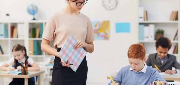 Teacher and school children at school