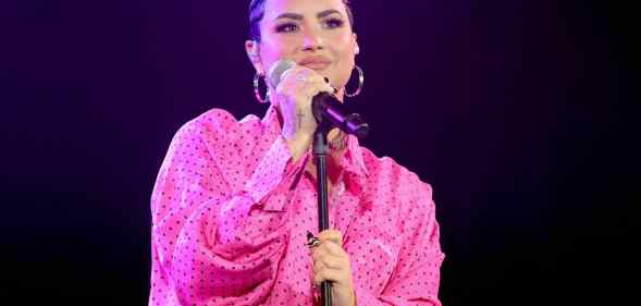 Demi Lovato performs onstage during the OBB Premiere Event in a pink dress