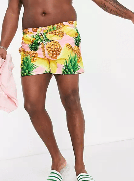A pair of pineapple swim shorts from the ASOS plus size collection.