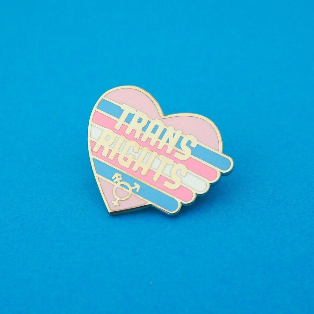 A Trans Rights pin. (fairycakes)