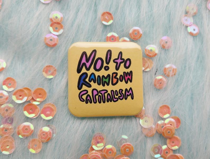 A "No! To Rainbow Capitalism" pin. (Doodlepeople)