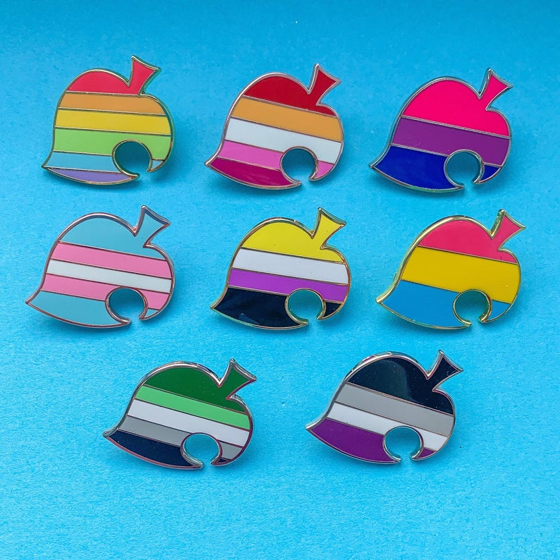 A collection of Animal Crossing themed pride pins. (teasuii)