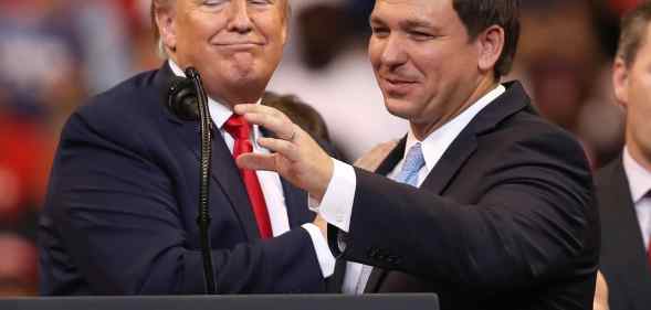 Donald Trump introduces Florida governor Ron DeSantis during a homecoming campaign rally