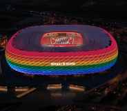 The Allianz Arena football stadium illuminated in rainbow colours