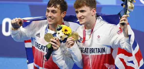 Tom Daley Matthew Lee pose with their gold medals at the Tokyo 2020 Olympic games