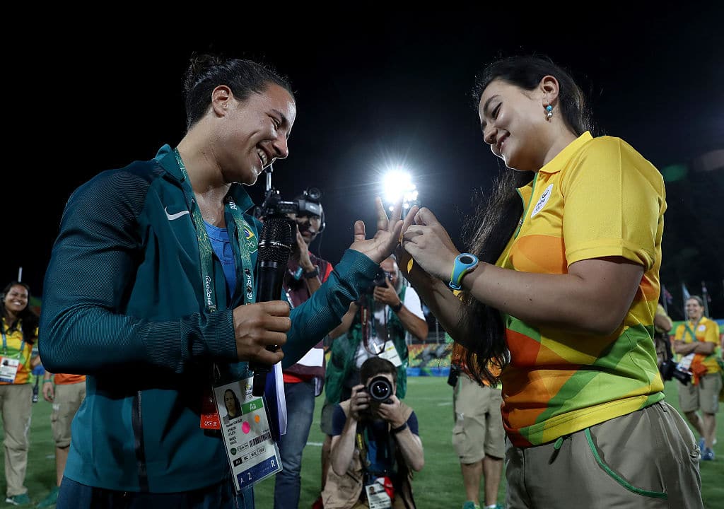 Marjorie Enya (R) proposes marriage to rugby player Isadora Cerullo 