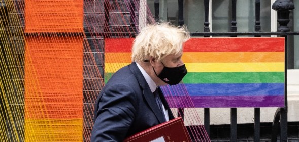 Boris Johnson walks beneath the Pride Month installation outside number 10