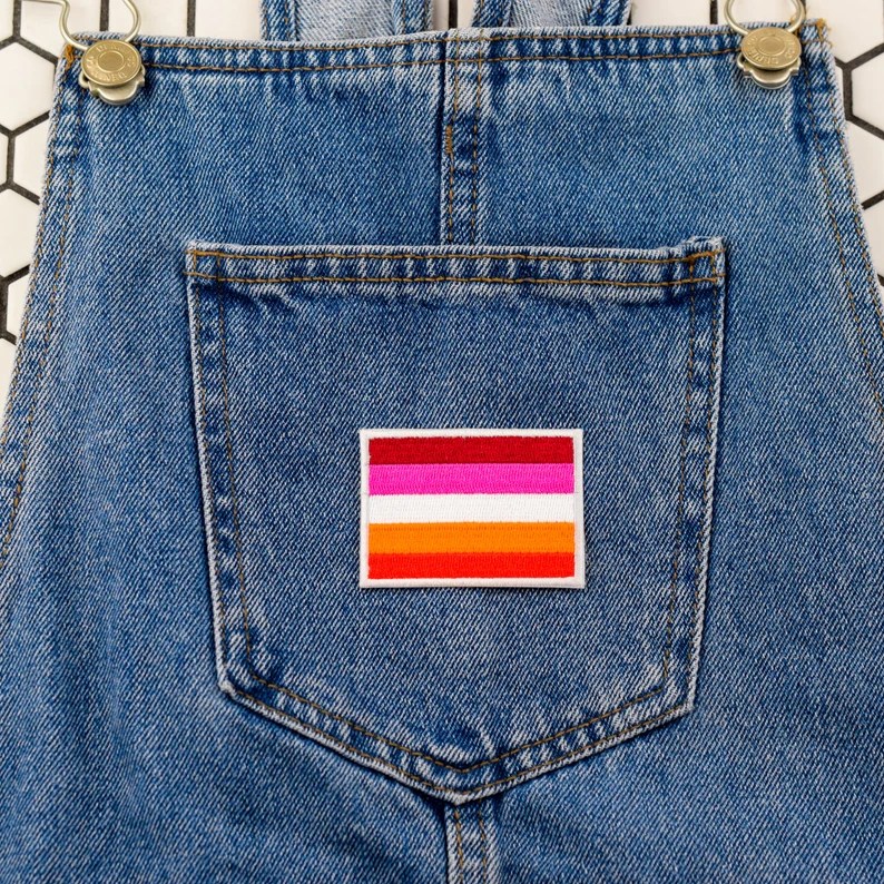 An embroidered patch of the lesbian Pride flag. (Etsy/LunaNQ)