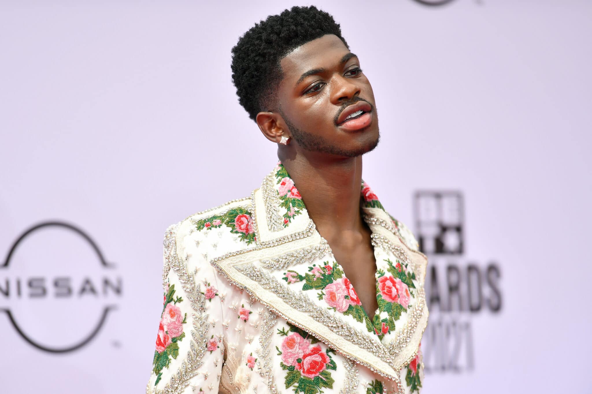 Lil Nas X in a floral suit with a super-wide lapel