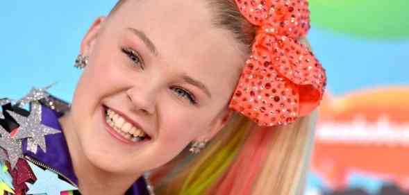 JoJo Siwa attends Nickelodeon's 2019 Kids' Choice Awards in an extremely colourful and sparkly outfit and orange giant hairbow