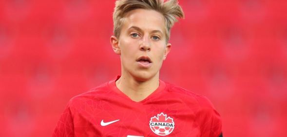 Quinn of Canada in a red football top with the Nike logo and Canadian maple leaf