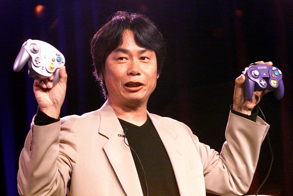 Shigeru Miyamoto with the Gamecube controller