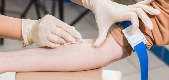 Close-up of doctor taking blood