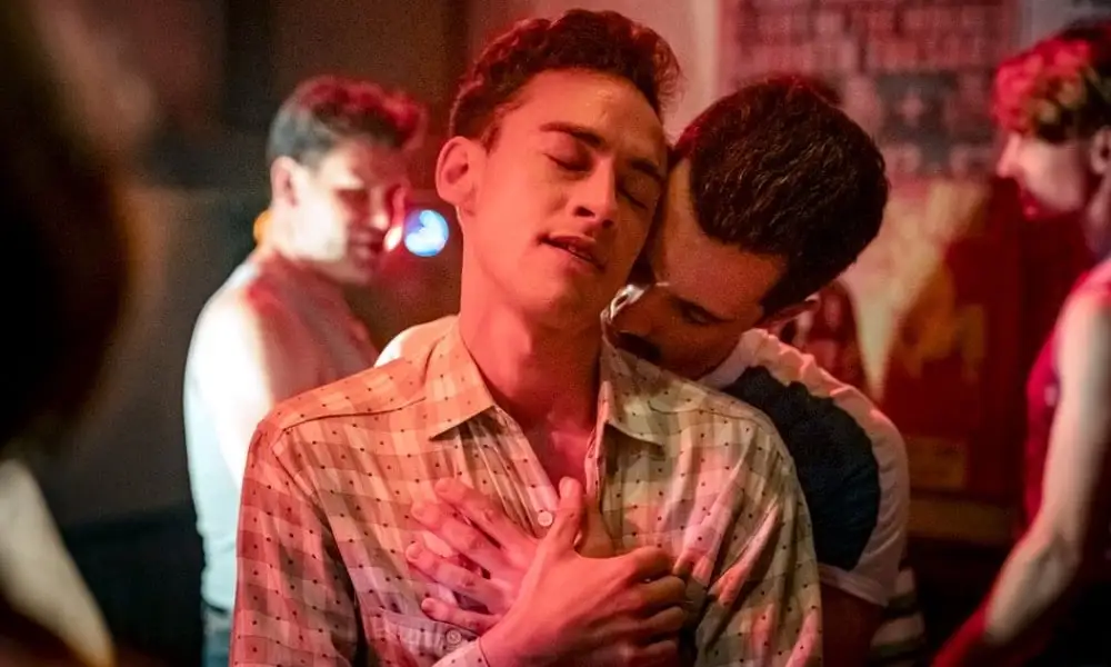 Olly Alexander in It's a Sin, embracing a man