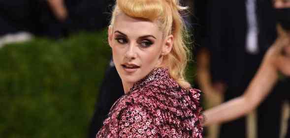 Kristen Stewart attends the Costume Institute Benefit at the Metropolitan Museum of Art in a gorgeous pink and black top