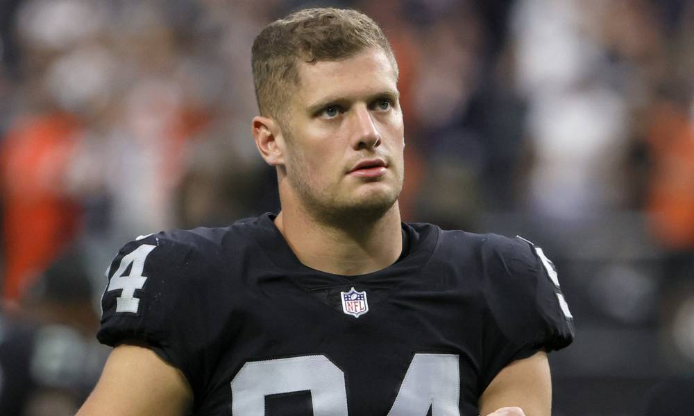 Las Vegas Raiders defensive end Carl Nassib (94) walks towards the