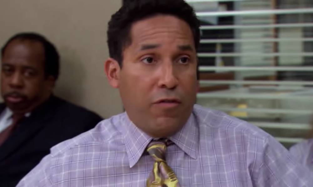 A still from the third season of The Office US where Oscar Martinez is outed by his boss to the entire office