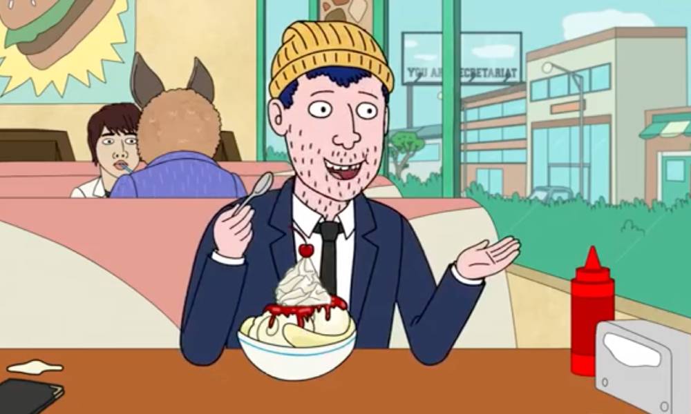 BoJack Horseman character Todd Chavez sits at a table with a large ice cream sundae in front of him