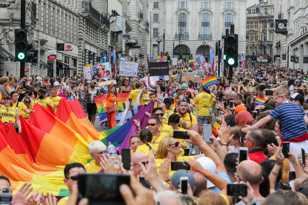 Huge crowd of participants with rainbow colours during the parade. The biggest ever, Pride In London parade in central London.