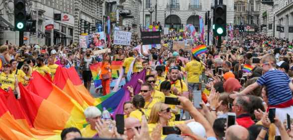 Huge crowd of participants with rainbow colours during the parade. The biggest ever, Pride In London parade in central London.