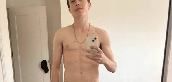 Elliot Page taking a topless mirror selfie