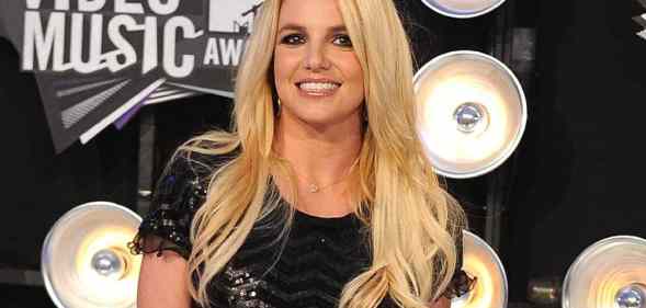 Britney Spears attends the MTV Video Music Awards in 2011 in a black sparkly outfit