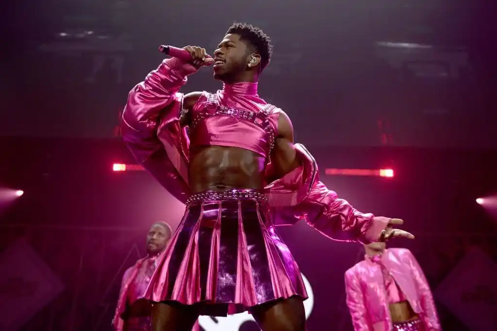 Lil Nas X performs onstage during iHeartRadio 103.5 KISS FM’s Jingle Ball 2021 in all pink