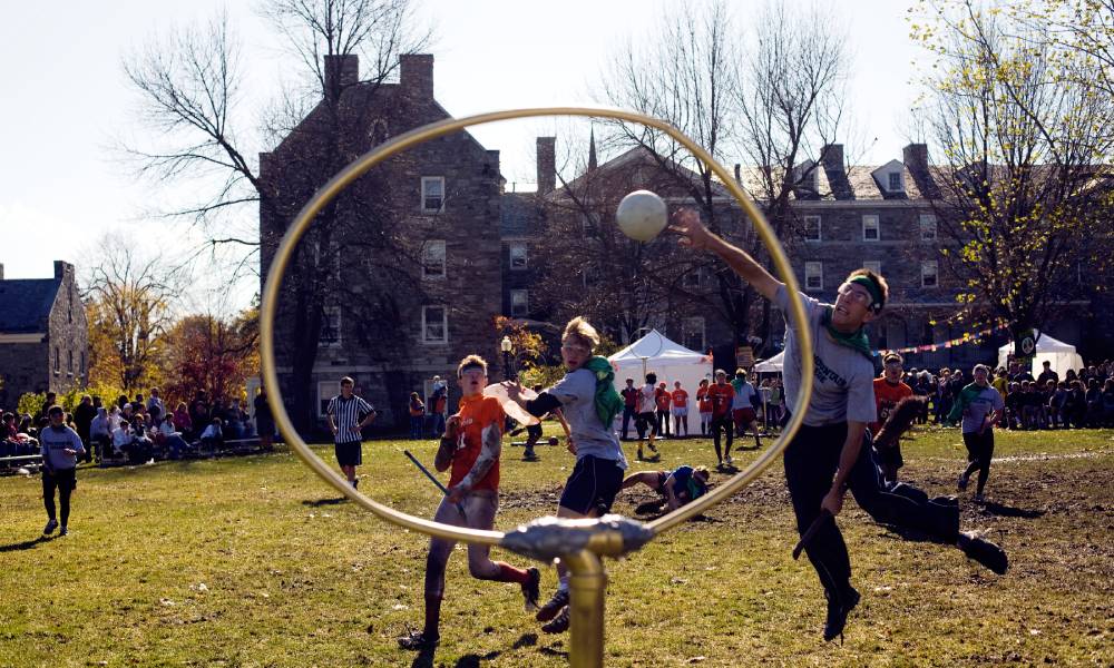 People at Middlebury College play at the first large Intercollegiate Quidditch Tournament 