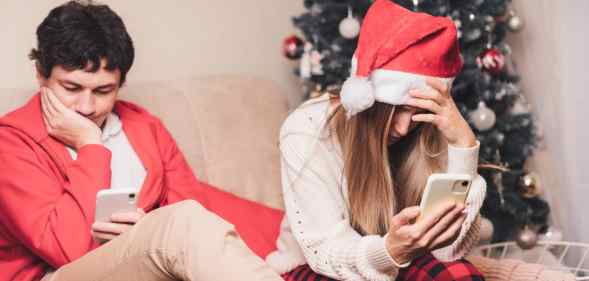 Two people looking miserable at Christmas