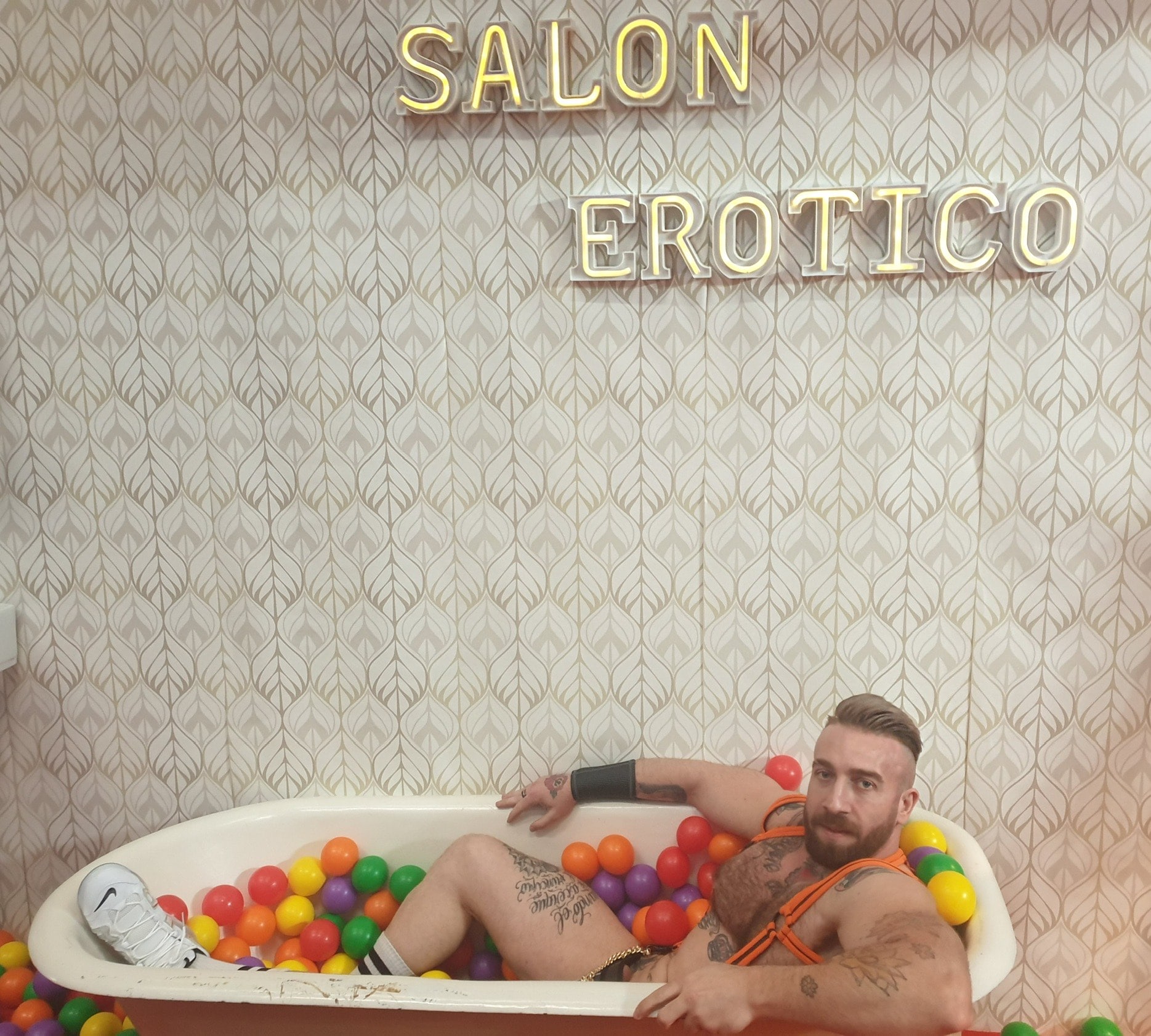 Manuel Scalco lying in a bathtub.