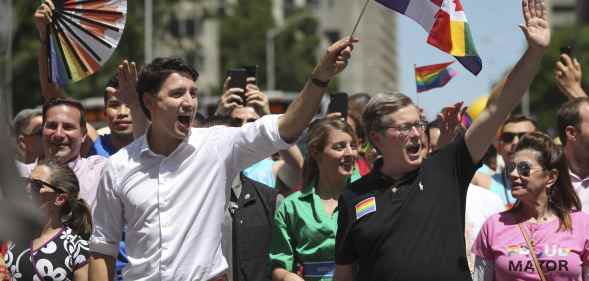 Canadian prime minister Justin Trudeau and Toronto mayor John Tory march at Toronto Prid