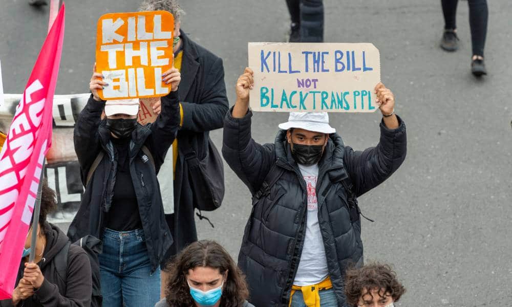 A protester holds a placard with the words "Kill the bill not Black Trans PPL" during Kill the Bill protest against the UK Government's policing bill