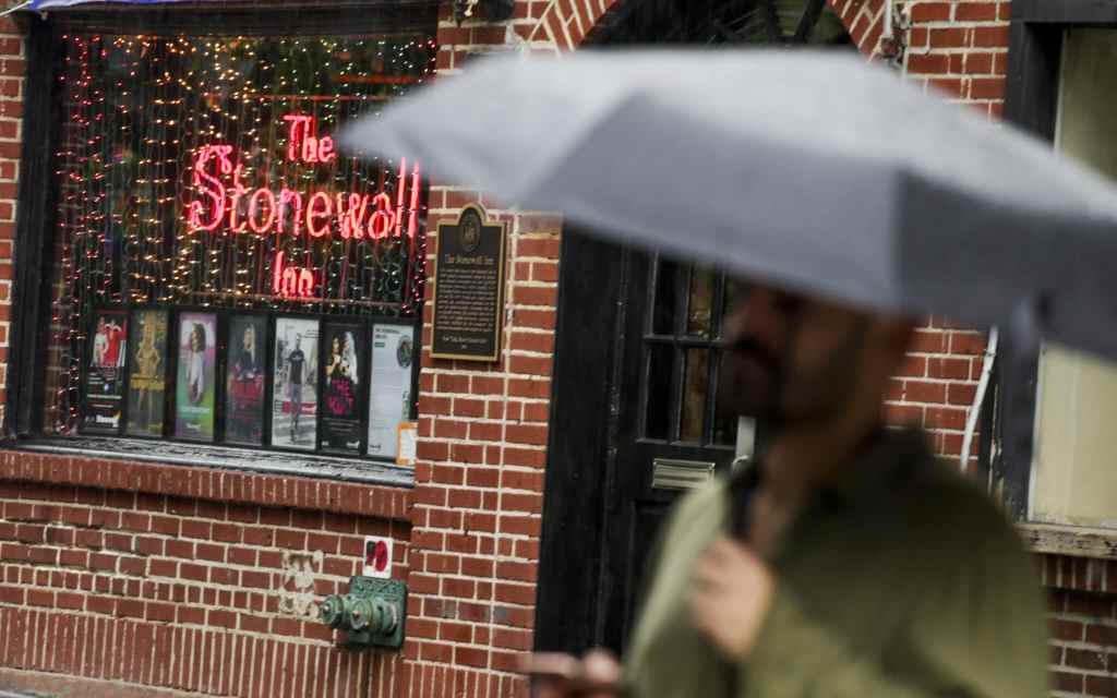 A man walks by the Stonewall Inn