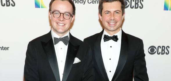 Pete and Chasten Buttigieg, who are husbands, are dressed in suits and ties for an event