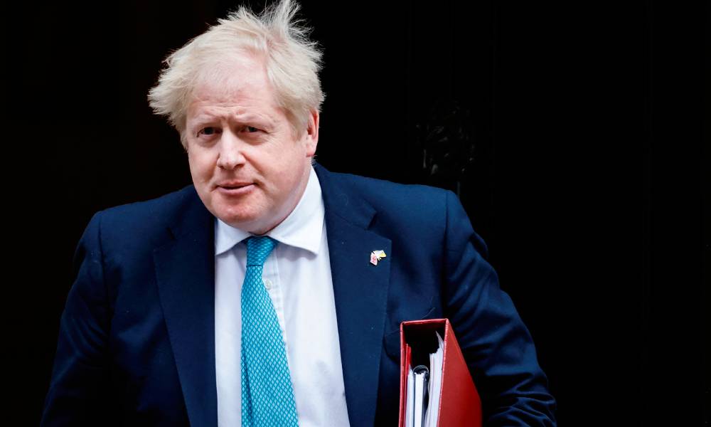 Prime Minister Boris Johnson leaves Cabinet meeting at 10 Downing Street on 23 March 2022 in order to attend the PMQ session at the House of Commons