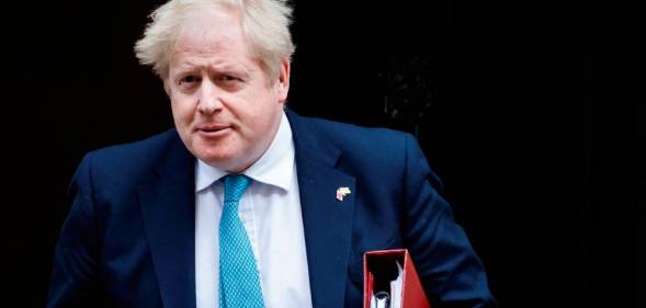 Prime Minister Boris Johnson leaves Cabinet meeting at 10 Downing Street on 23 March 2022 in order to attend the PMQ session at the House of Commons