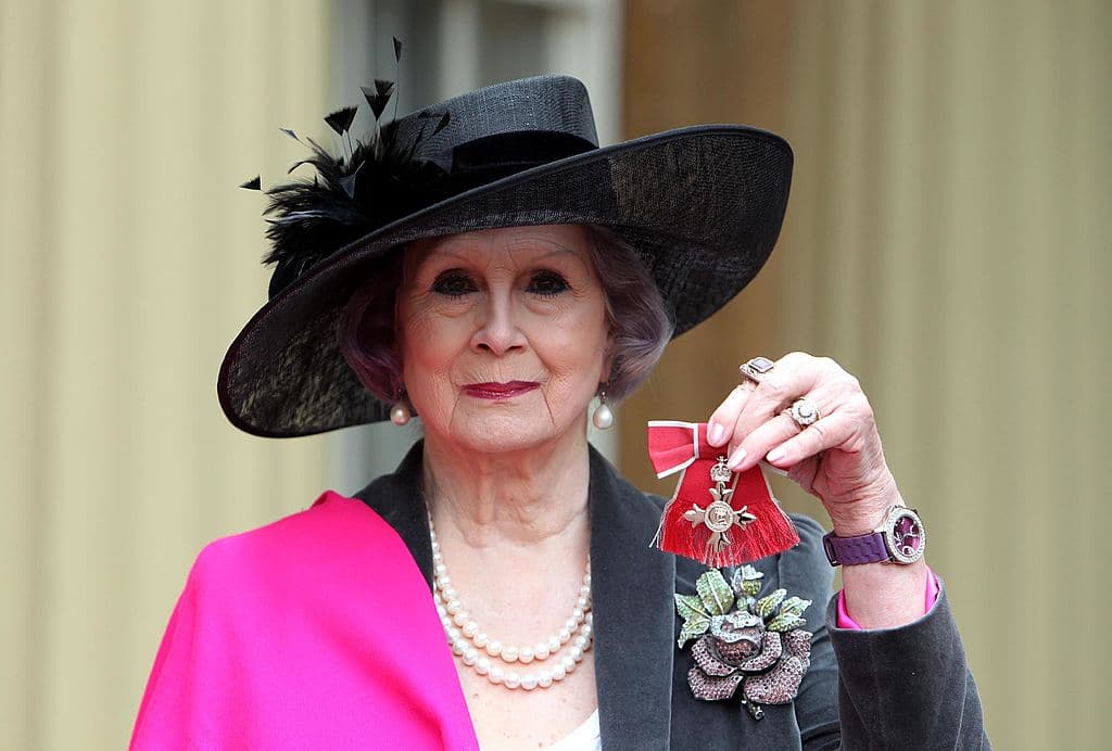 April Ashley holds her Member of the British Empire (MBE) medal which was awarded to her by Queen Elizabeth II in 2012. 