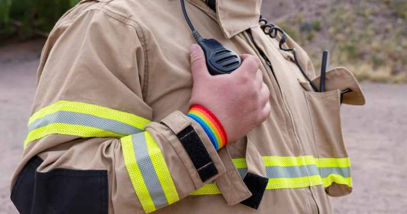 Firefighter wearing LGBT bracelet.