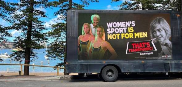 A billboard created by Advance Australia targeting independent Warringah MP Zali Steggall which includes the slogan “women's sport is not for men” as well as photos of top swimmers Dawn Fraser, Emma McKeon and Emily Seebohm.