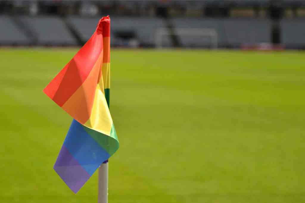 LGBTQ+ flag in a football stadium