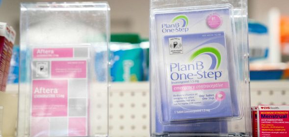 Plan B and Aftera sit locked on a shelf in a pharmacy in Washington, DC